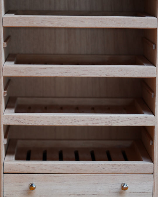 inside of Maccarrone dea tyche humidor cabinet with cedar drawers
