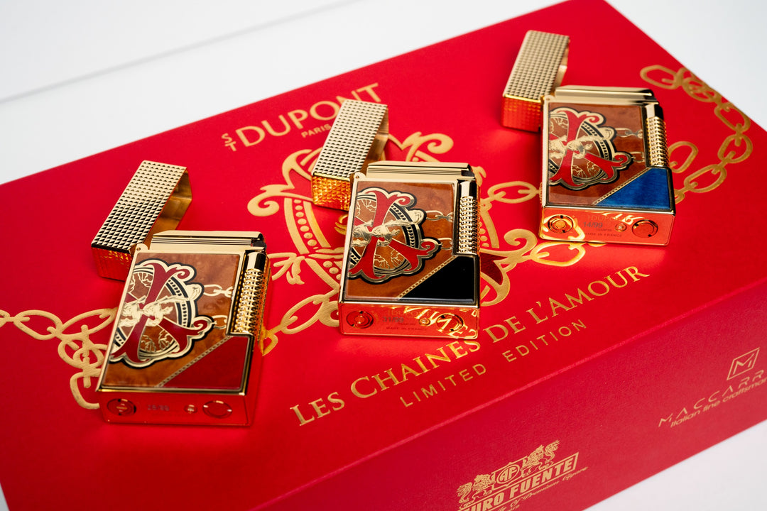 OpusX Les Chaînes de l'Amour limited edition marquetry lighters in red, black and blue on the red presentation box