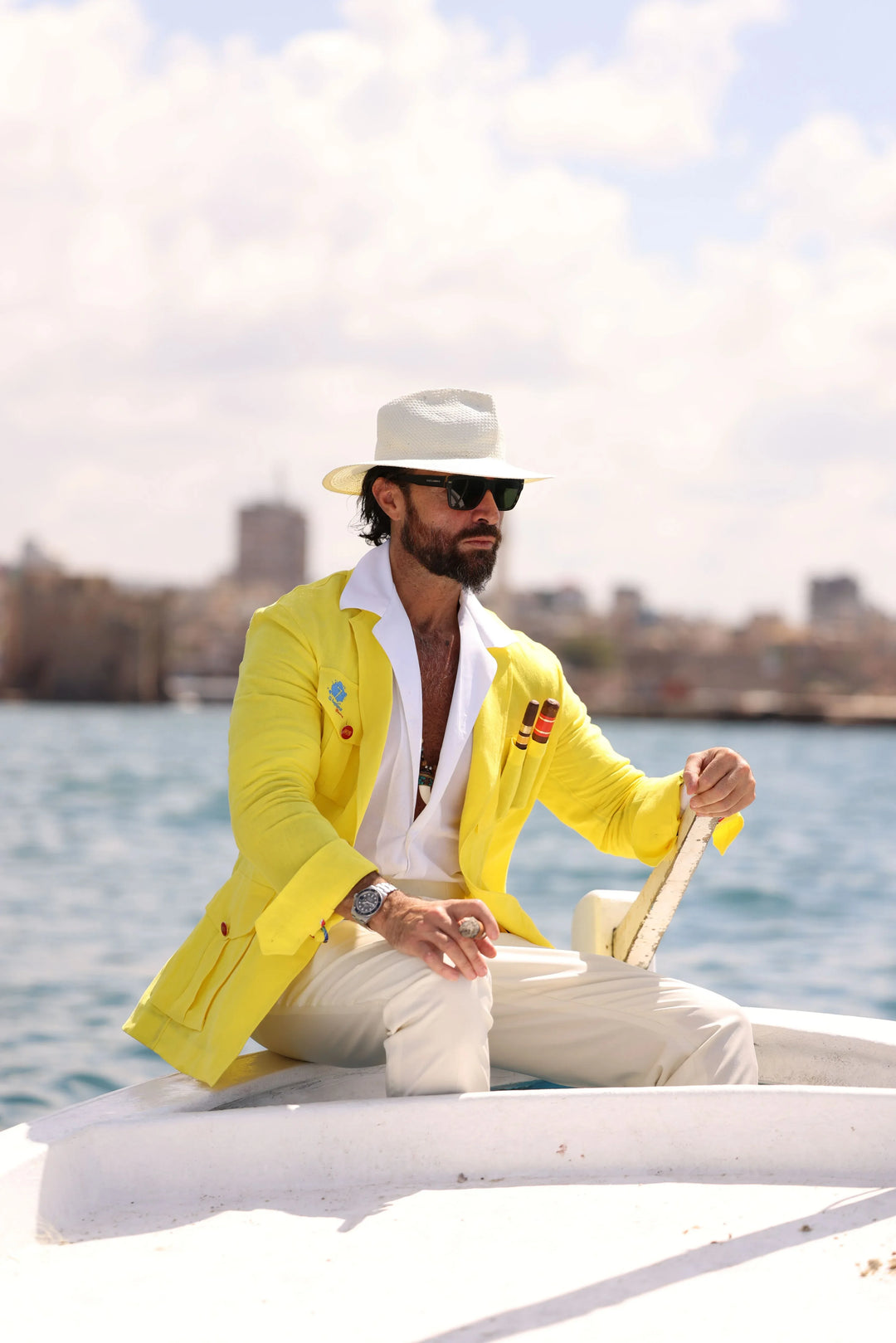 Man wearing a yellow El Septimo Smoking Suit Jacket with 3 cigar pockets available at Cigar Inc in Woodland Hills, Los Angeles