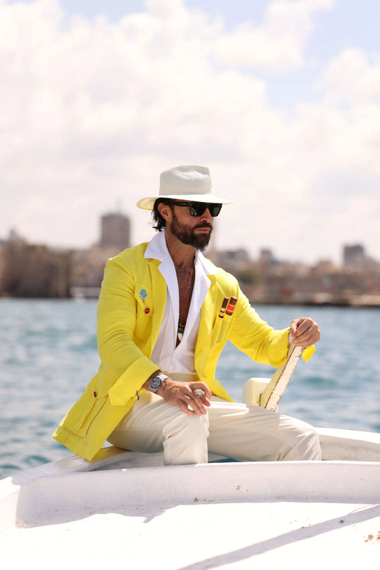 Man wearing a yellow El Septimo Smoking Suit Jacket with 3 cigar pockets available at Cigar Inc in Woodland Hills, Los Angeles
